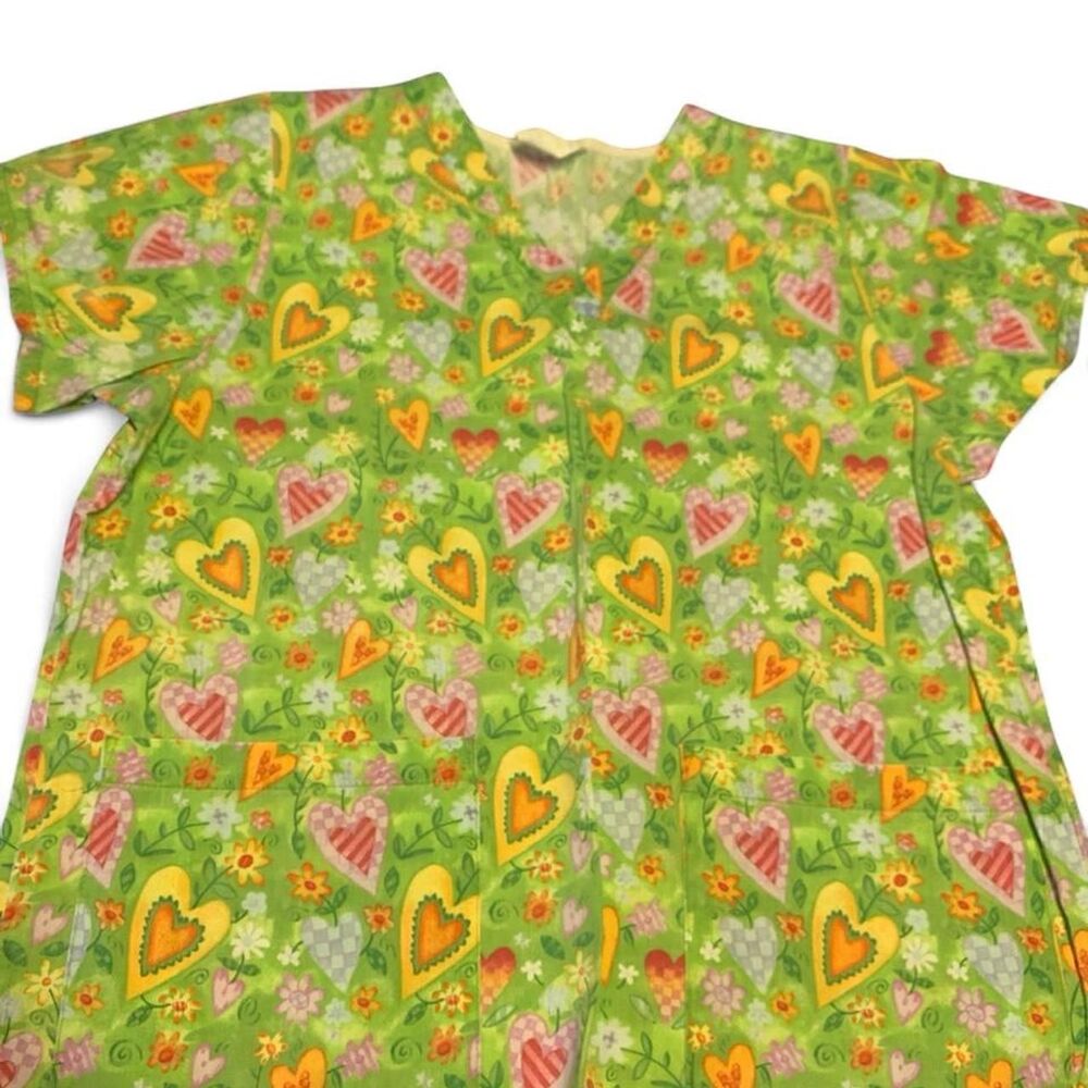 Green floral scrub top with heart pattern